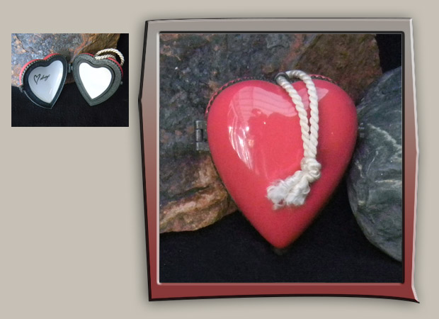 pink heart box in porcelain, has frame inside for picture.