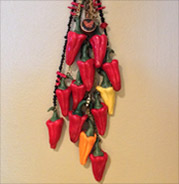 red ristra of peppers with beads and chain