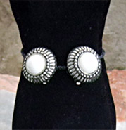 well-crafted silver and white lip-on earrings