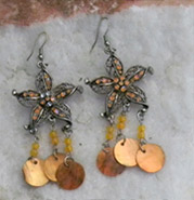 Beach hippie look with crystal studded starfish focusand shell dangles