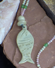designer beaded necklace with fish figure carved in soapstone