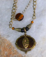 handmade designer necklace with chain and animal skin designer beads