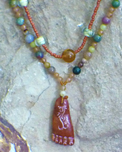 designer beaded necklace with brown agate foot charm