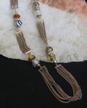 handmade designer necklace features an intricate chain with bold designer-type beads