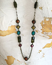 Long chain necklace with interspersed wire-wrapped beads