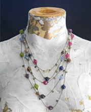 necklace of faceted beads of many colors and shapes for pretty, layered effect.