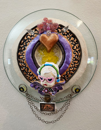 circular wall-hanging with cupid in steampunk style