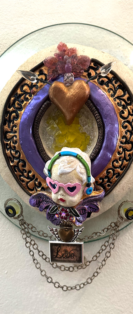 steampunk assemblage art with ceramic cupid and ornaments